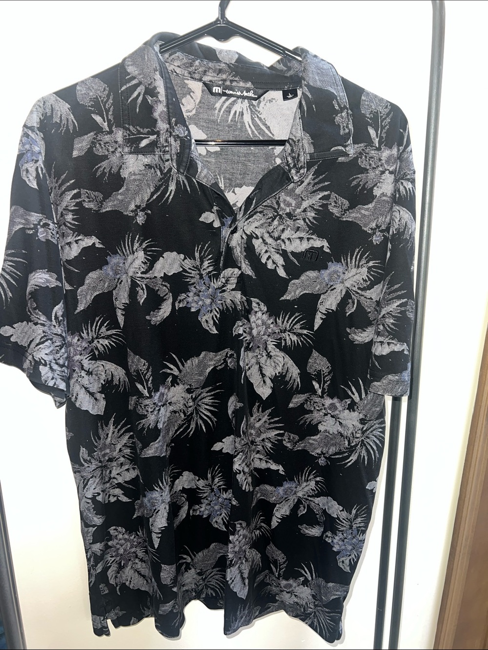 Men's Travis Mathew Breathable Black Floral Short-Sleeve polo